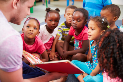 teacher reading to a class